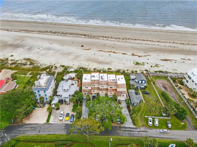 aerial view of waterfront with a beach