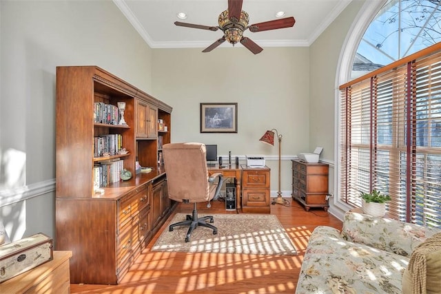 office area with crown molding, plenty of natural light, and light hardwood / wood-style floors