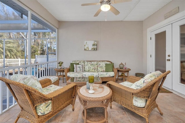 sunroom with french doors and ceiling fan