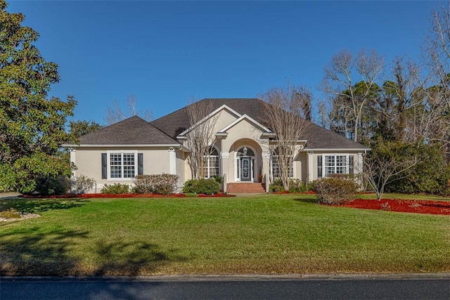 view of front of property with a front lawn