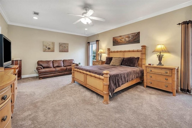 bedroom with ceiling fan, light colored carpet, and crown molding