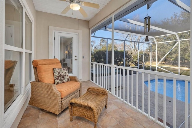 sunroom / solarium with ceiling fan