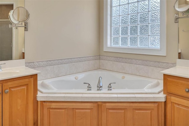 bathroom featuring a bathing tub and vanity