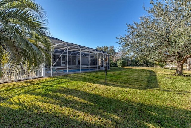 view of yard featuring glass enclosure