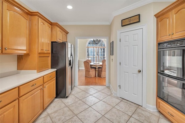 kitchen featuring black double oven, light tile patterned floors, stainless steel refrigerator with ice dispenser, and ornamental molding