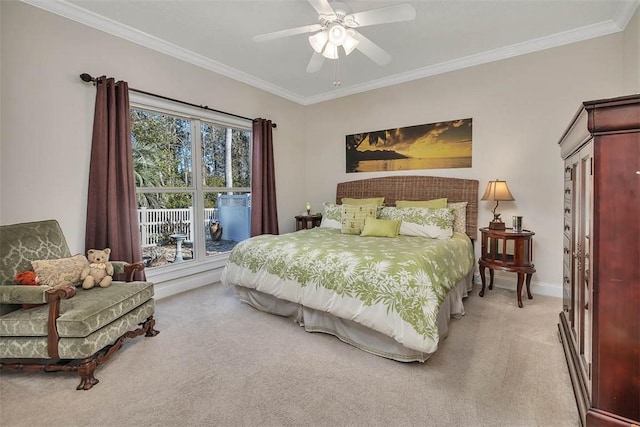 bedroom featuring multiple windows, light carpet, and ceiling fan