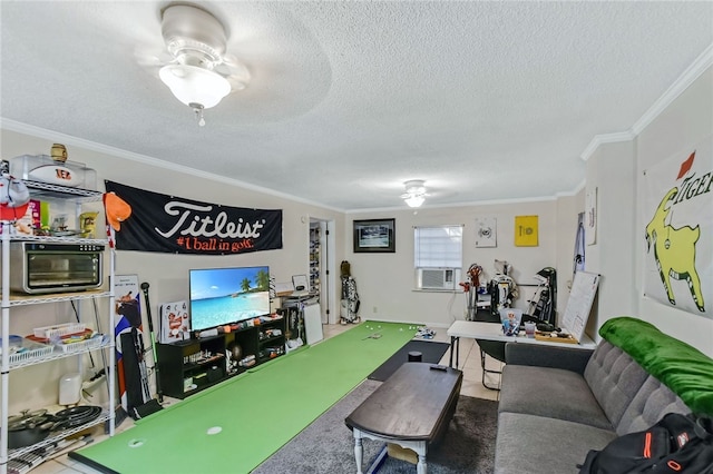 game room featuring tile patterned flooring, ornamental molding, a textured ceiling, and ceiling fan