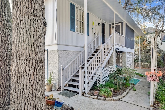 doorway to property featuring covered porch