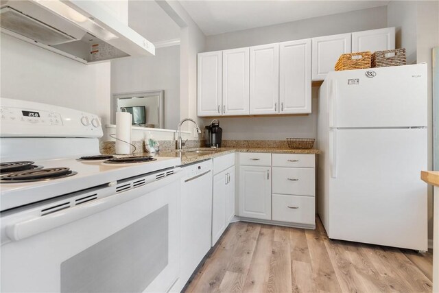 kitchen with sink, light hardwood / wood-style flooring, white appliances, wall chimney range hood, and white cabinets