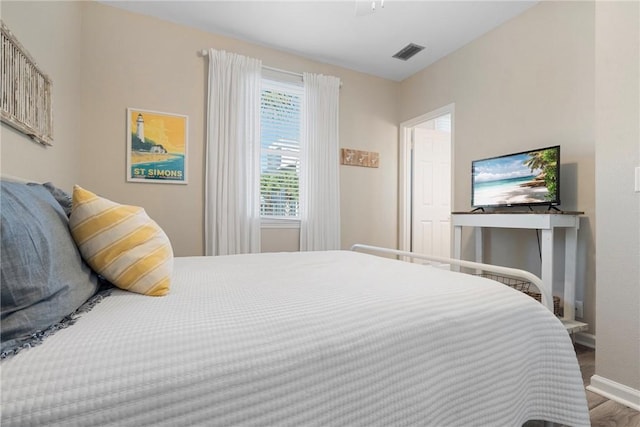 bedroom featuring hardwood / wood-style floors