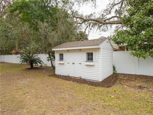 view of outbuilding featuring a yard