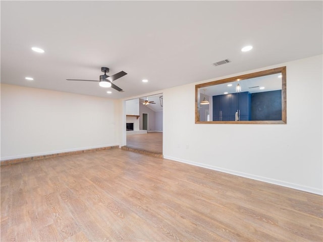 spare room with ceiling fan and light hardwood / wood-style flooring