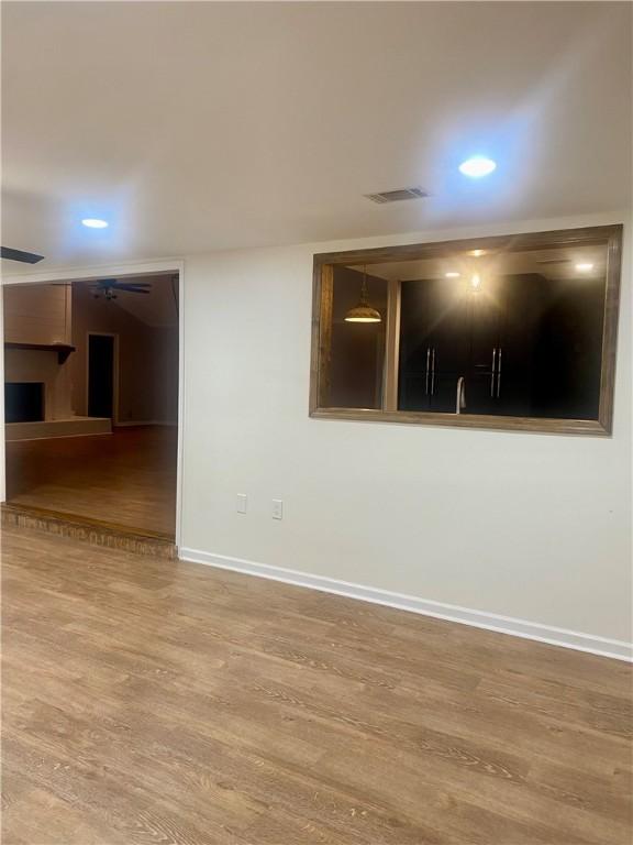 spare room featuring hardwood / wood-style floors