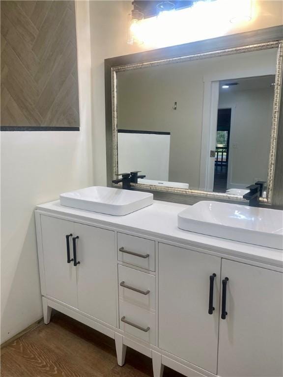 bathroom with vanity and hardwood / wood-style flooring