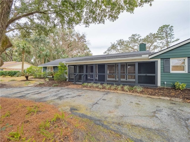 exterior space featuring a sunroom