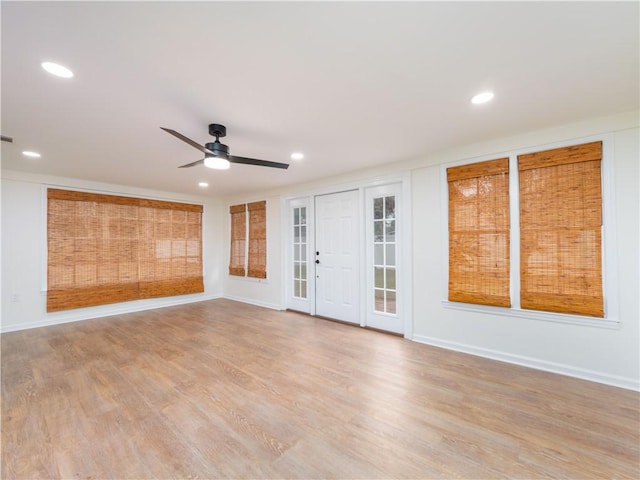 empty room with light hardwood / wood-style floors and ceiling fan