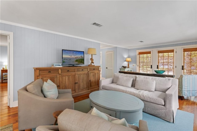 living room with light hardwood / wood-style flooring