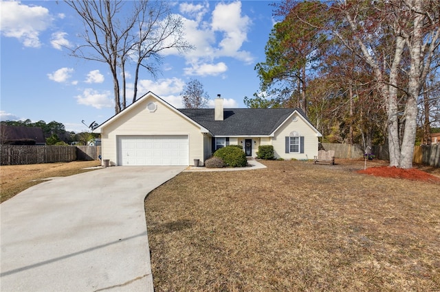 ranch-style house featuring a garage and a front yard