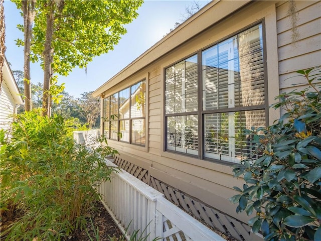 view of home's exterior with fence