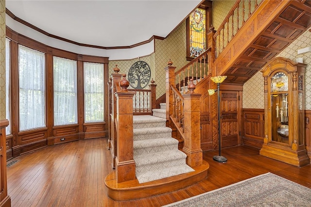 1000 Union St, Brunswick, GA 31520 - stairs with wallpapered walls, hardwood / wood-style floors, ornamental molding, and a wainscoted wall