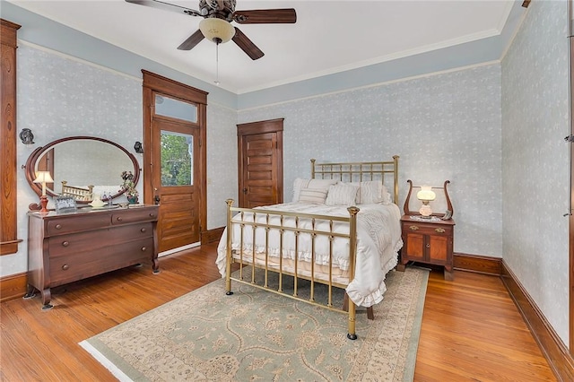 1000 Union St, Brunswick, GA 31520 - bedroom with wood finished floors, wallpapered walls, crown molding, and a ceiling fan