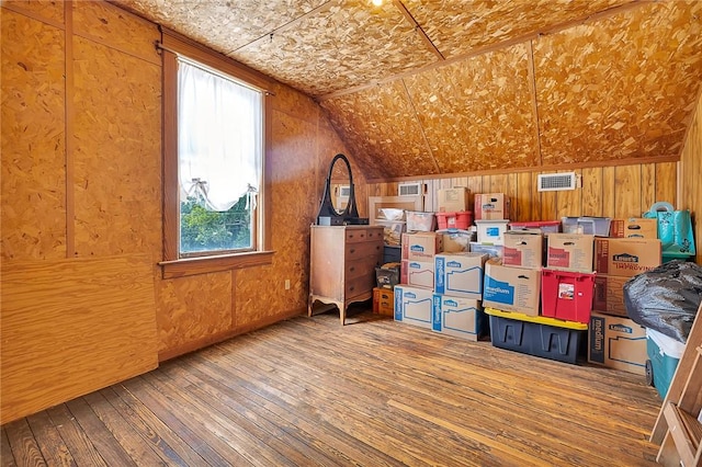 1000 Union St, Brunswick, GA 31520 - additional living space with hardwood / wood-style flooring, healthy amount of natural light, lofted ceiling, and wood walls