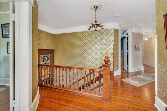 1000 Union St, Brunswick, GA 31520 - corridor featuring wallpapered walls, wood-type flooring, and stairway