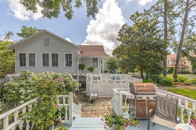1000 Union St, Brunswick, GA 31520 - back of house featuring a deck and a shingled roof