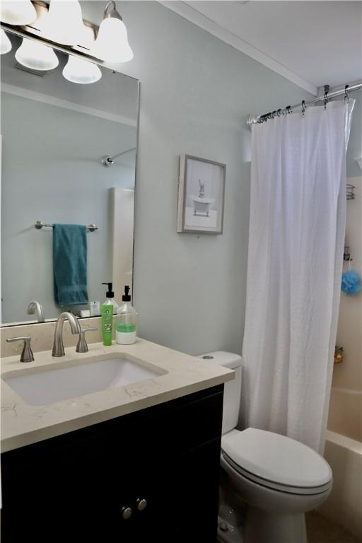 102 Avalon Ct, Kingsland, GA 31548 - bathroom with vanity, shower / bathtub combination with curtain, and crown molding
