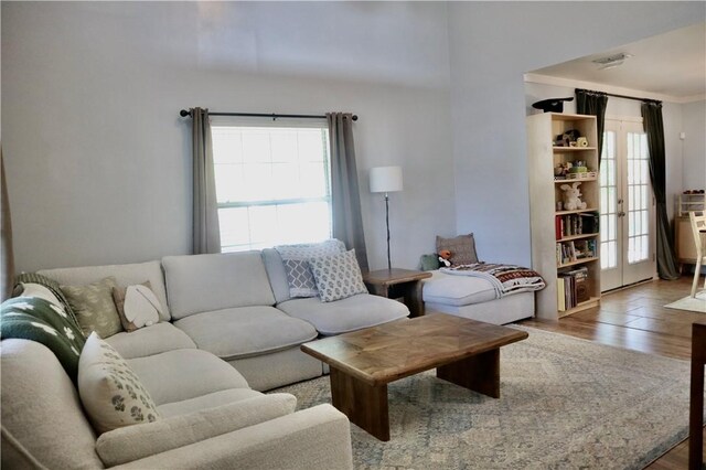 102 Avalon Ct, Kingsland, GA 31548 - living room featuring wood finished floors and french doors