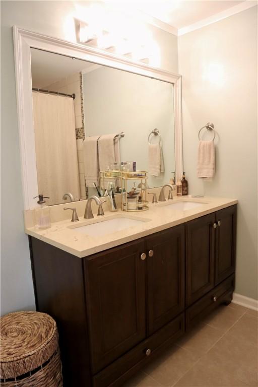102 Avalon Ct, Kingsland, GA 31548 - full bathroom featuring double vanity, ornamental molding, and tile patterned floors