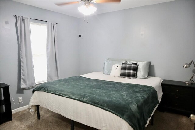 102 Avalon Ct, Kingsland, GA 31548 - carpeted bedroom with baseboards and a ceiling fan