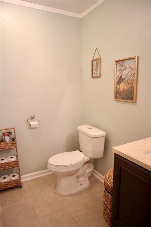 102 Avalon Ct, Kingsland, GA 31548 - half bath with vanity, crown molding, and tile patterned flooring