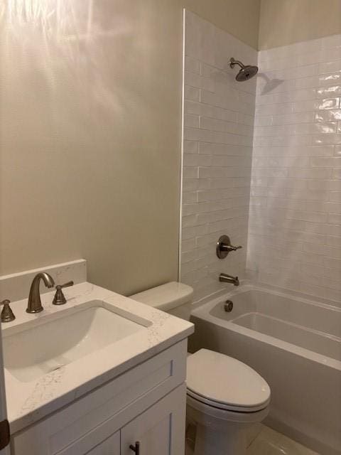 bathroom with shower / bathing tub combination, vanity, and toilet