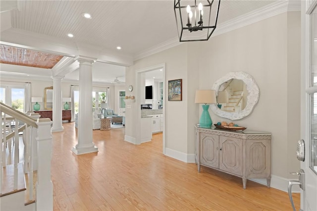 entryway featuring decorative columns, recessed lighting, light wood-style flooring, and crown molding