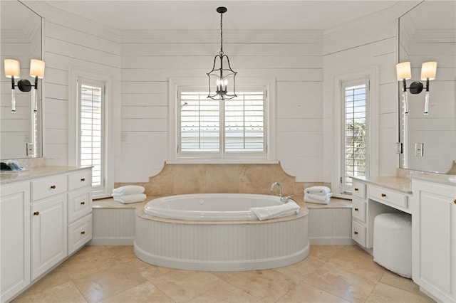 full bathroom featuring a garden tub, tile patterned flooring, and vanity