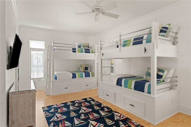 bedroom with light wood finished floors and ceiling fan