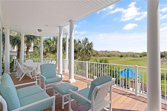 wooden deck with outdoor dining area