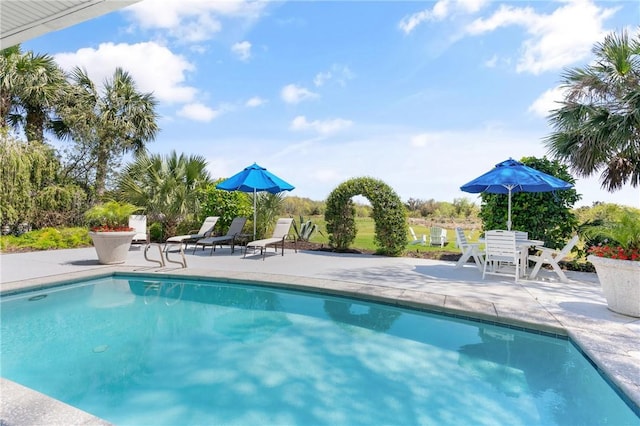 outdoor pool featuring a patio