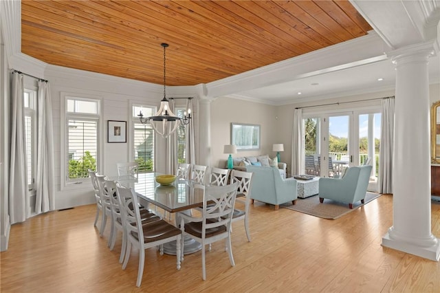 dining room with light wood-style flooring, wood ceiling, ornamental molding, and decorative columns