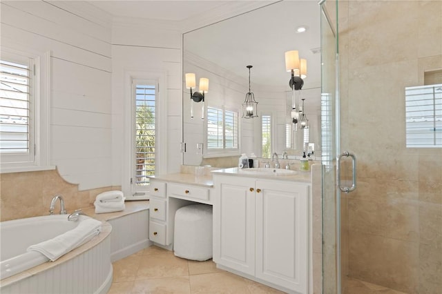 bathroom featuring a shower stall, tile patterned flooring, vanity, a bath, and crown molding