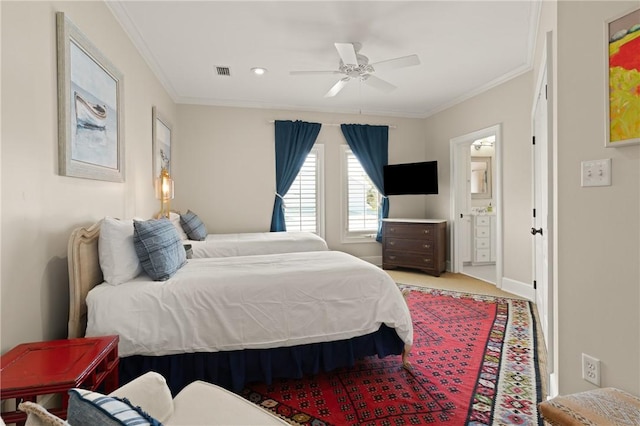 bedroom with a ceiling fan, crown molding, baseboards, carpet flooring, and visible vents