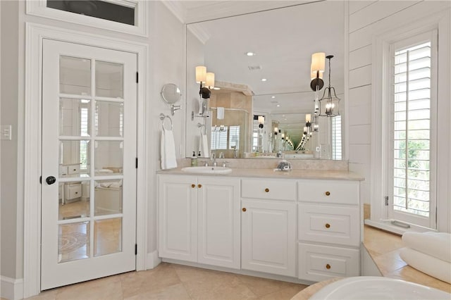 bathroom with a stall shower, recessed lighting, tile patterned flooring, vanity, and ornamental molding
