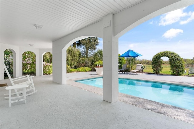 pool featuring a patio area