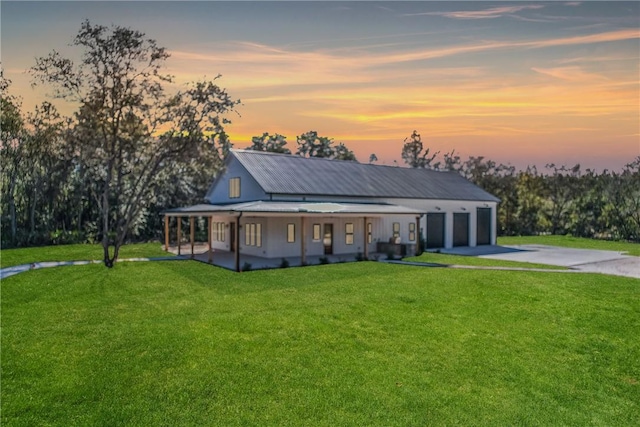 view of front of home with a lawn and covered porch