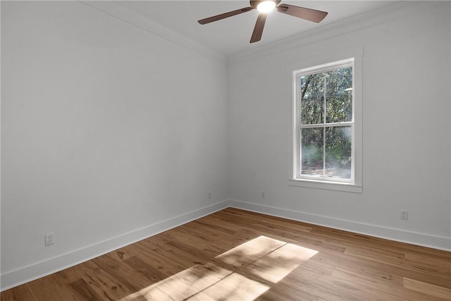 unfurnished room with ceiling fan, crown molding, and light hardwood / wood-style flooring