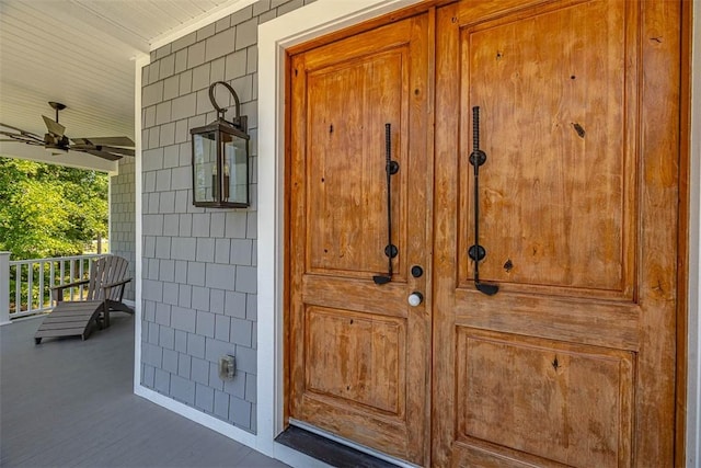 entrance to property featuring ceiling fan