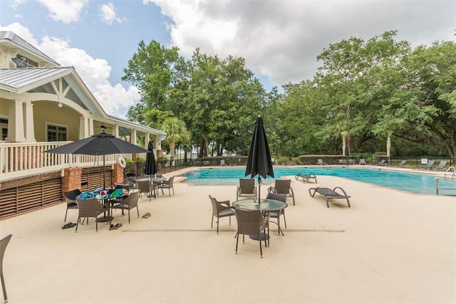 view of swimming pool featuring a patio area