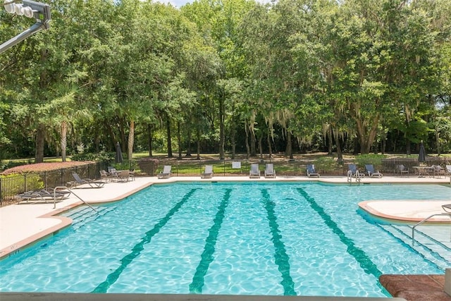 view of swimming pool with a patio area