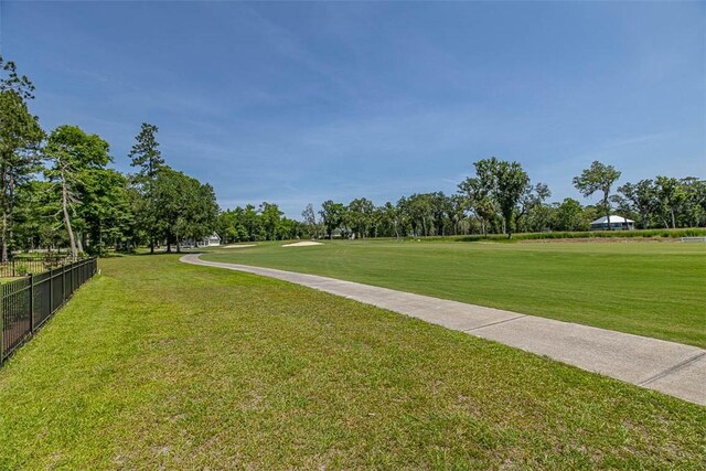 view of property's community with a yard